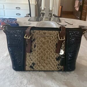 A black and cream shoulder handbag by Brahmin.